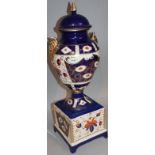 An early 20thC garniture vase, in Imari palette, on block base with gilt highlights, printed crown