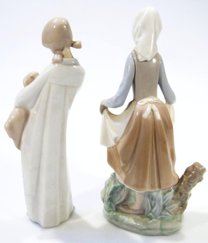 A Lladro Daisa figure group, of a lady holding apron on a naturalistic ground, 25cm high, and a - Image 2 of 4