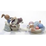 A Lladro figure Lavando Al Perro Bashful Bather, no. 05455, printed marks beneath, 14cm high, and