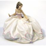 A Lladro porcelain figure, of a lady with a flowing dress holding a fan, impressed no. 5859 to the