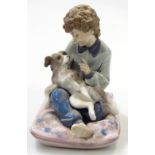 A Lladro figure Cuentos A Mi Perito, no. 5703, printed marks beneath, 14cm high. (boxed)