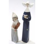 A Lladro Daisa figure group, of a standing nun, no. 5500, 27cm high, and a farmhand holding chicken,