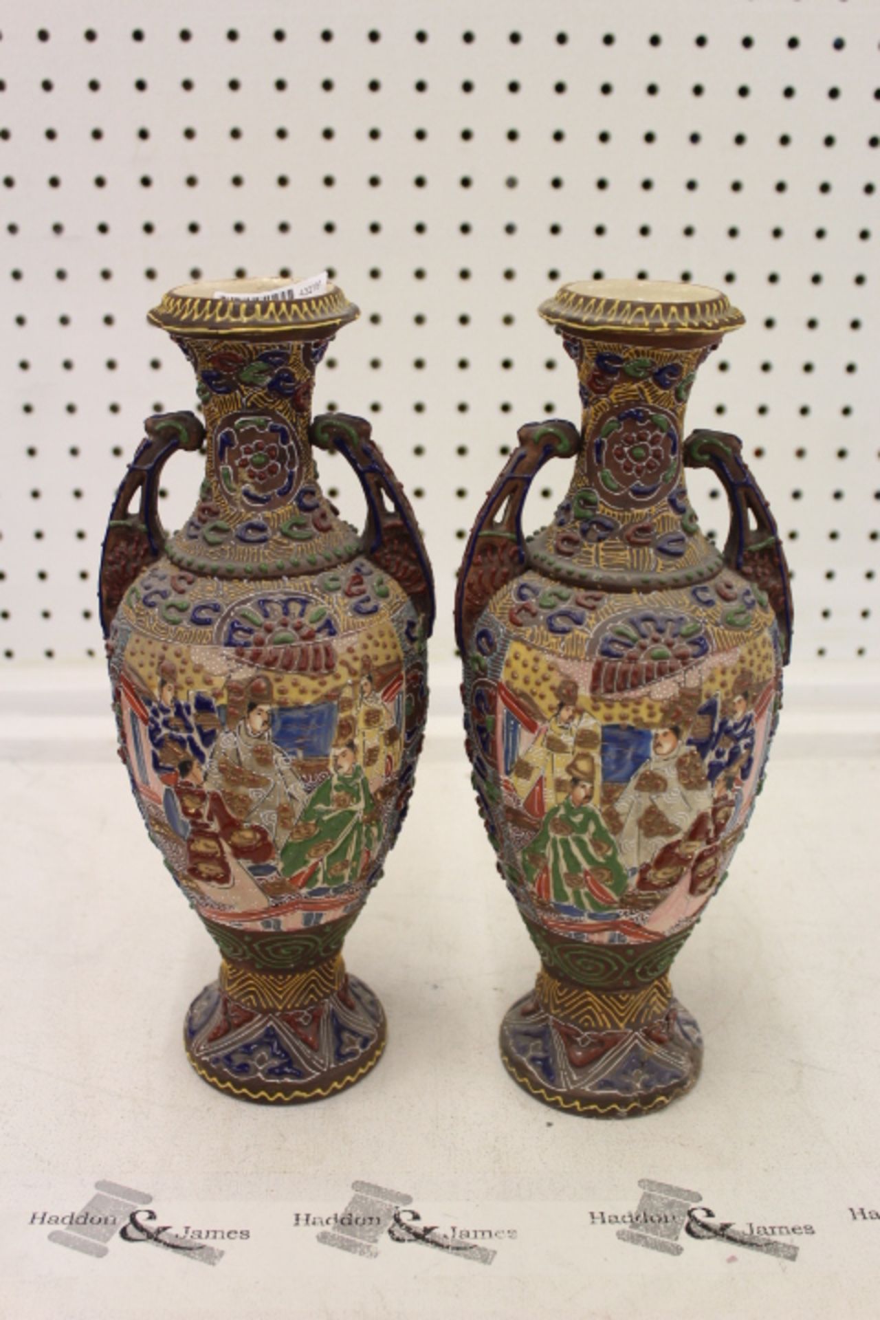 Two 32cm Oriental Embossed Depicting Emperors Vases