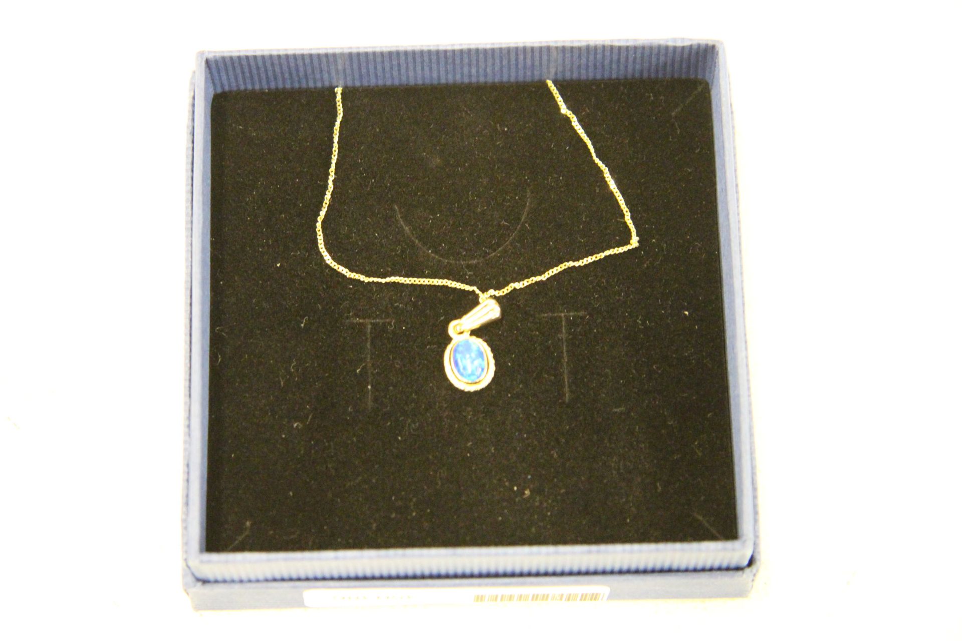 Yellow Gold Chain & Blue Opal Pendant