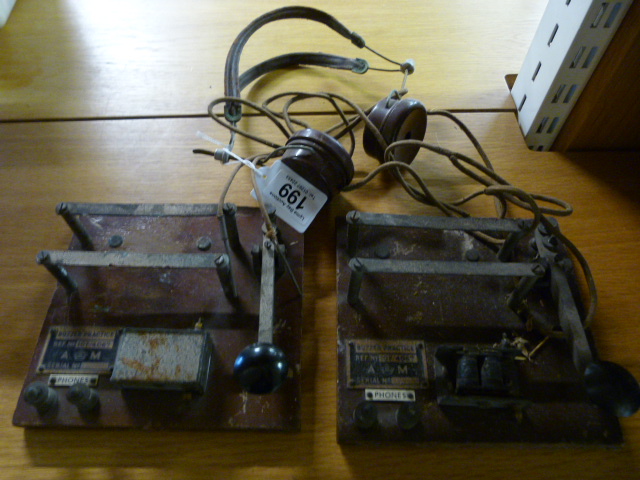 Two Morse code boards and a pair of Bakelite headphones