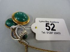 Malachite pendant on chain,with a matching brooch set in gold coloured metal, along with a silver