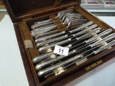 A Elkington silver plated part canteen of cutlery in a mahogany box