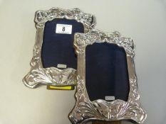 A pair of hallmarked silver Art Nouveau style photo frames