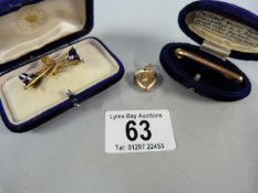9 ct gold pin ( weight 3.2g), a 9 ct gold heart (weight 1.4g) and an enamelled brocch