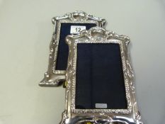 A pair of hallmarked silver Art Nouveau style photo frames