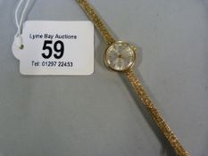 Ladies 9 ct gold Garrard watch with 9 ct strap- total weight 16.2g