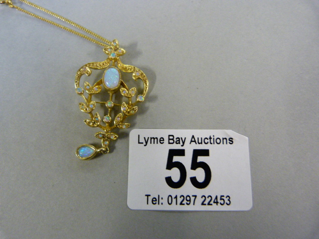 A gold and silver opalene pendant on 925 marked chain
