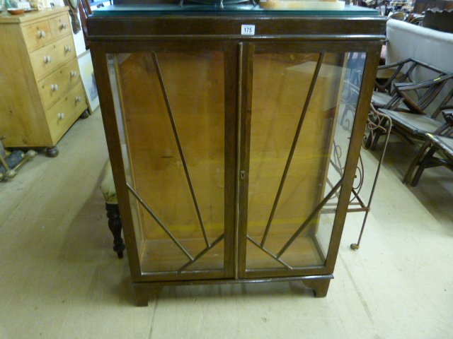 A Glass fronted display cabinet