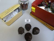 A quantity of buttons inc african heads