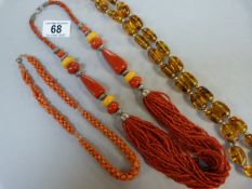 A Coral Necklace, an amber style necklace and one other