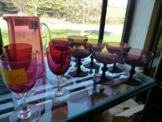 A quantity of coloured glass including cranberry