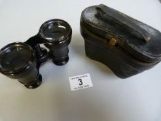 A Pair of cased opera glasses