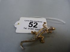 A Lizard brooch in 9ct gold set with diamonds