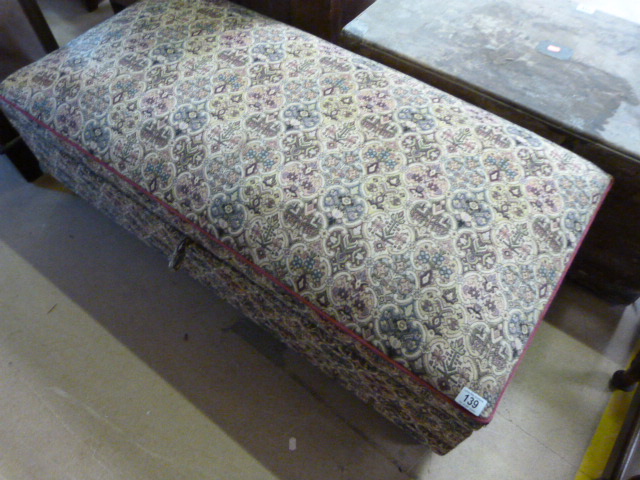 An upholstered sprung Ottoman