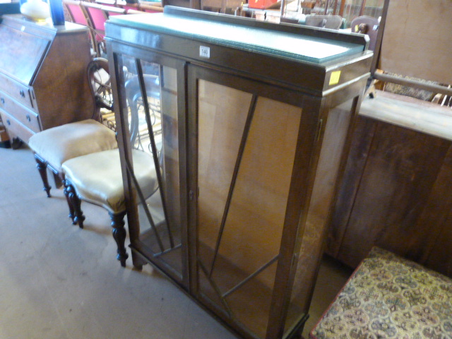 A Glass fronted display cabinet
