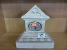 A Portland stone mantle clock
