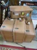 A Set of four vintage suitcases