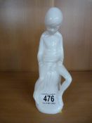 A spode figure of a boy