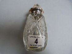 Cut glass sugar shaker with silver top