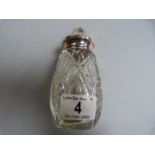 Cut glass sugar shaker with silver top