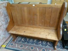 A Gothic style pine pew