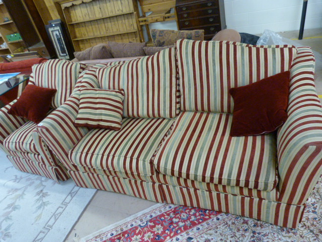 A striped two seater sofa and matching armchair