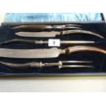 A cased silver mounted carving set with horn handles- case A/F