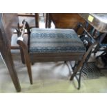 An upholstered piano stool