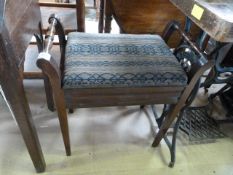 An upholstered piano stool