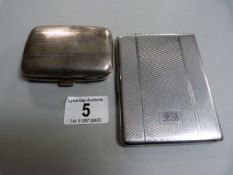 A hallmarked silver cigarette case and one other