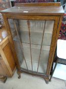 A Glass fronted display cabinet