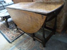 An antique oak gateleg table