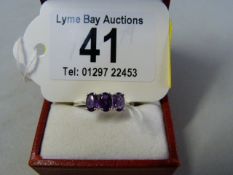 A three stone Amethyst ring set in 9ct white gold