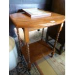 A small occasional table on barley twist legs