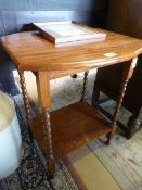 A small occasional table on barley twist legs