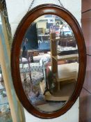 Oval framed mirror