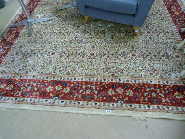 Ivory ground Kashmir rug with a red border