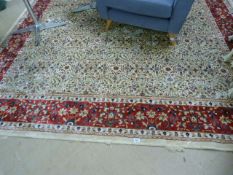 Ivory ground Kashmir rug with a red border