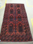 Red ground afghan tribal bluche rug