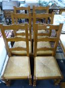 An oak refrectory table and six chairs