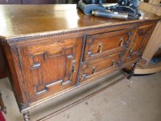 An Oak jacobean style dresser base on barley twist legs