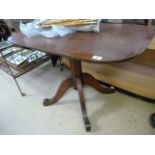 An elm rectangular tripod table with Gothic influence