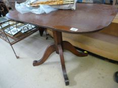 An elm rectangular tripod table with Gothic influence