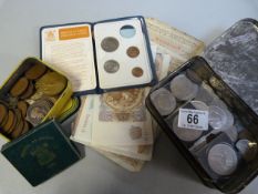 A quantity of various coins in two tins and a quantity of banknotes