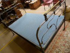 A French brass and iron double bed